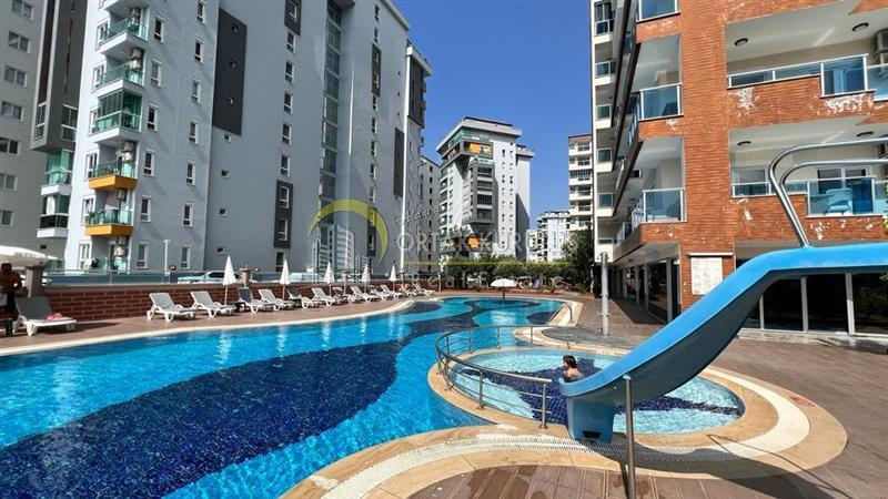 Alanya, Mahmutlar, Novita – 1+1 möblierte Wohnung im ersten Stock zu verkaufen