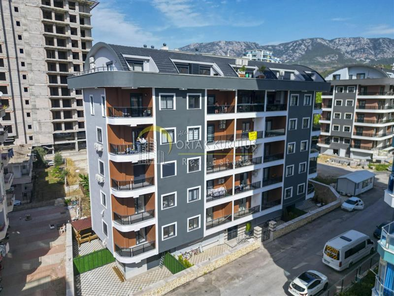 Mahmutlar Alarahan Residence برای فروش ۱+۱ | ساختمان نوساز، ۳۰۰ متر تا دریا، نمای شرقی