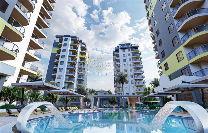Mahmutlar Üçgen Park Satılık 1+1 | Krediye Uygun 75 m² Açık & Kapalı Havuzlu