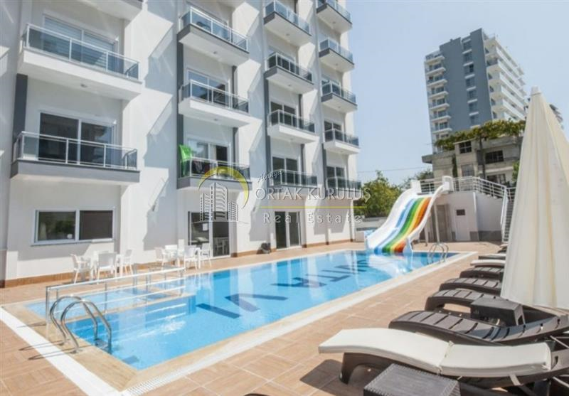 Mahmutlar Satılık 1+1 Eşyalı | 3. Kat Güney-Batı Cepheli Açık & Kapalı Havuzlu