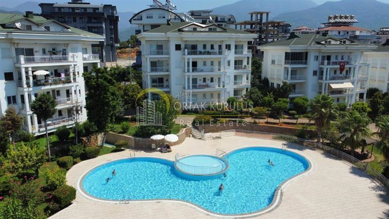 'Fully Furnished 2+1 Apartment Suitable for Residence in Alanya Oba! Comfortable Living with Outdoor Pool, Elevator, and Security Cameras!'